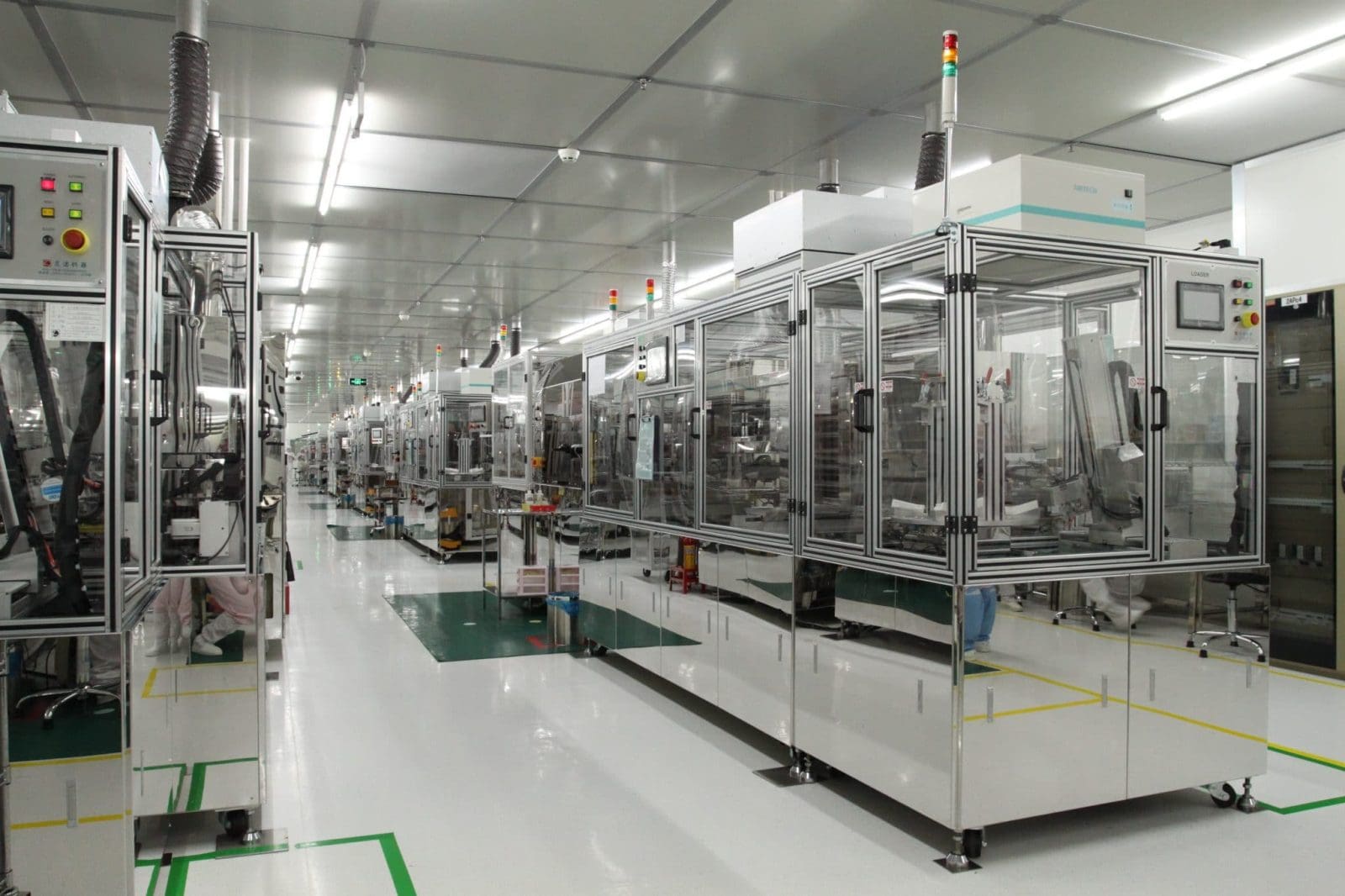 Orient Display automated cell-assembly line, a corridor of enclosed machines with status towers inside a cleanroom